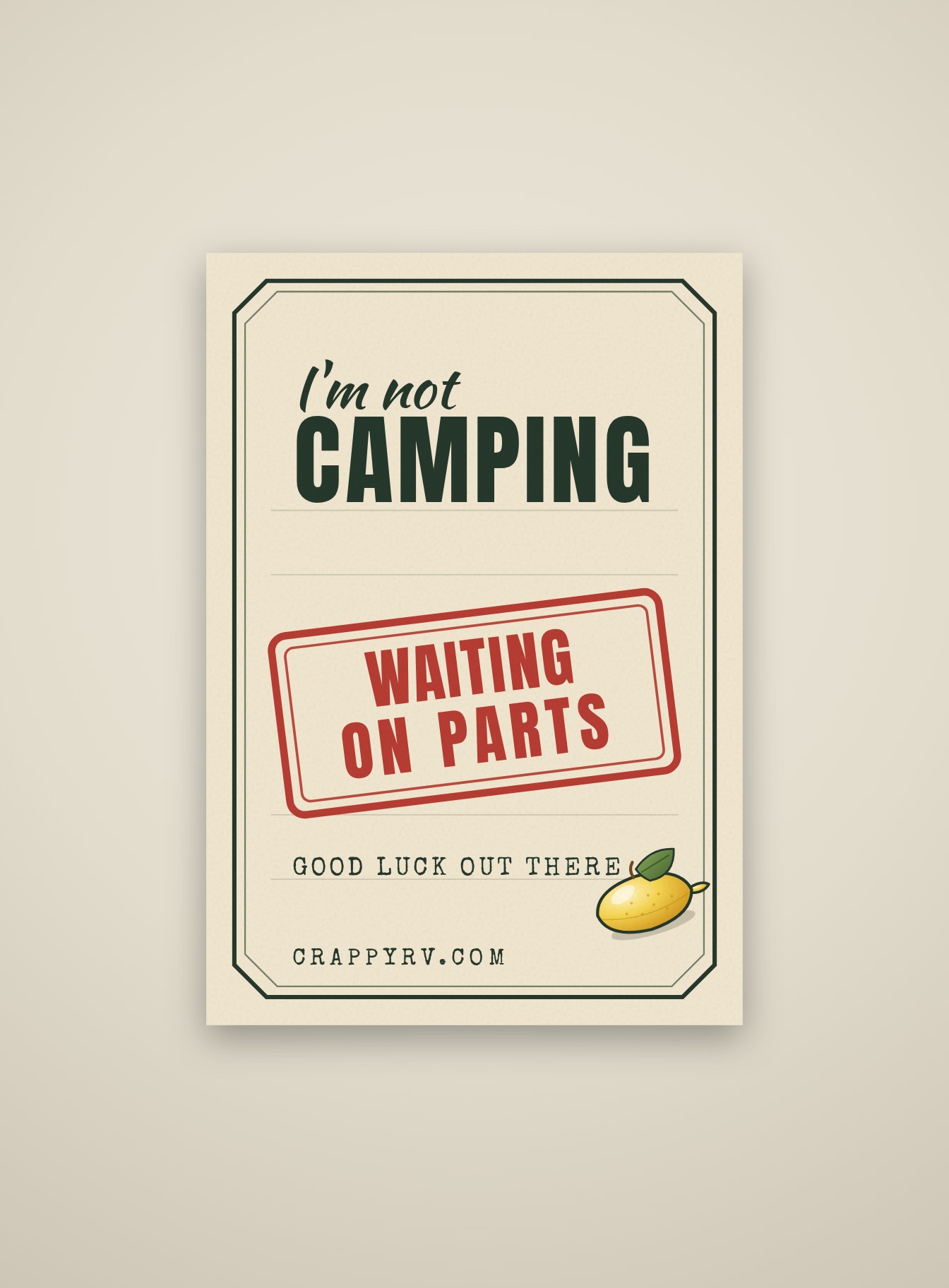 Cream campsite garden flag reading I'M NOT CAMPING with a red rubber stamp reading WAITING ON PARTS, a lemon, and CRAPPYRV.COM