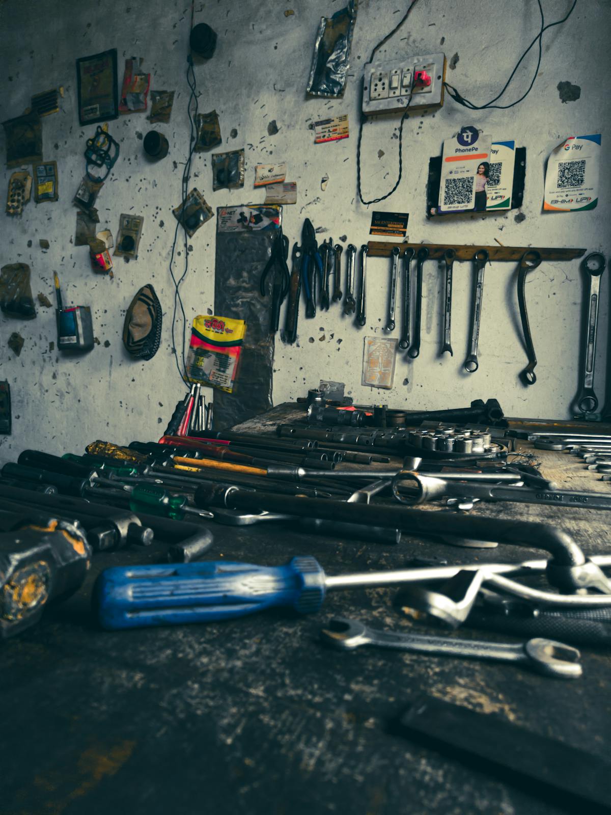 Hand tools laid out on a workshop bench.