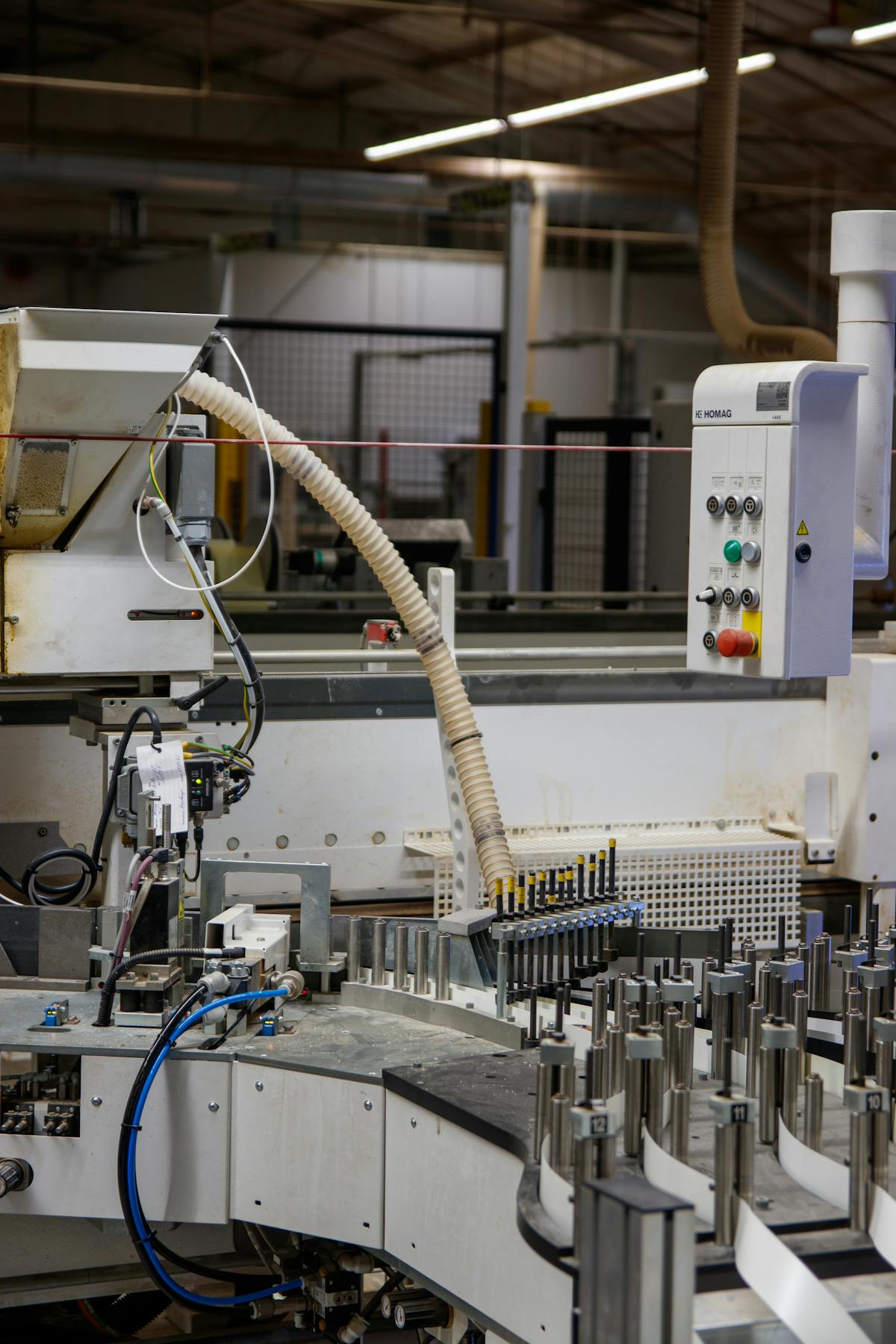 An industrial assembly line with equipment in operation.