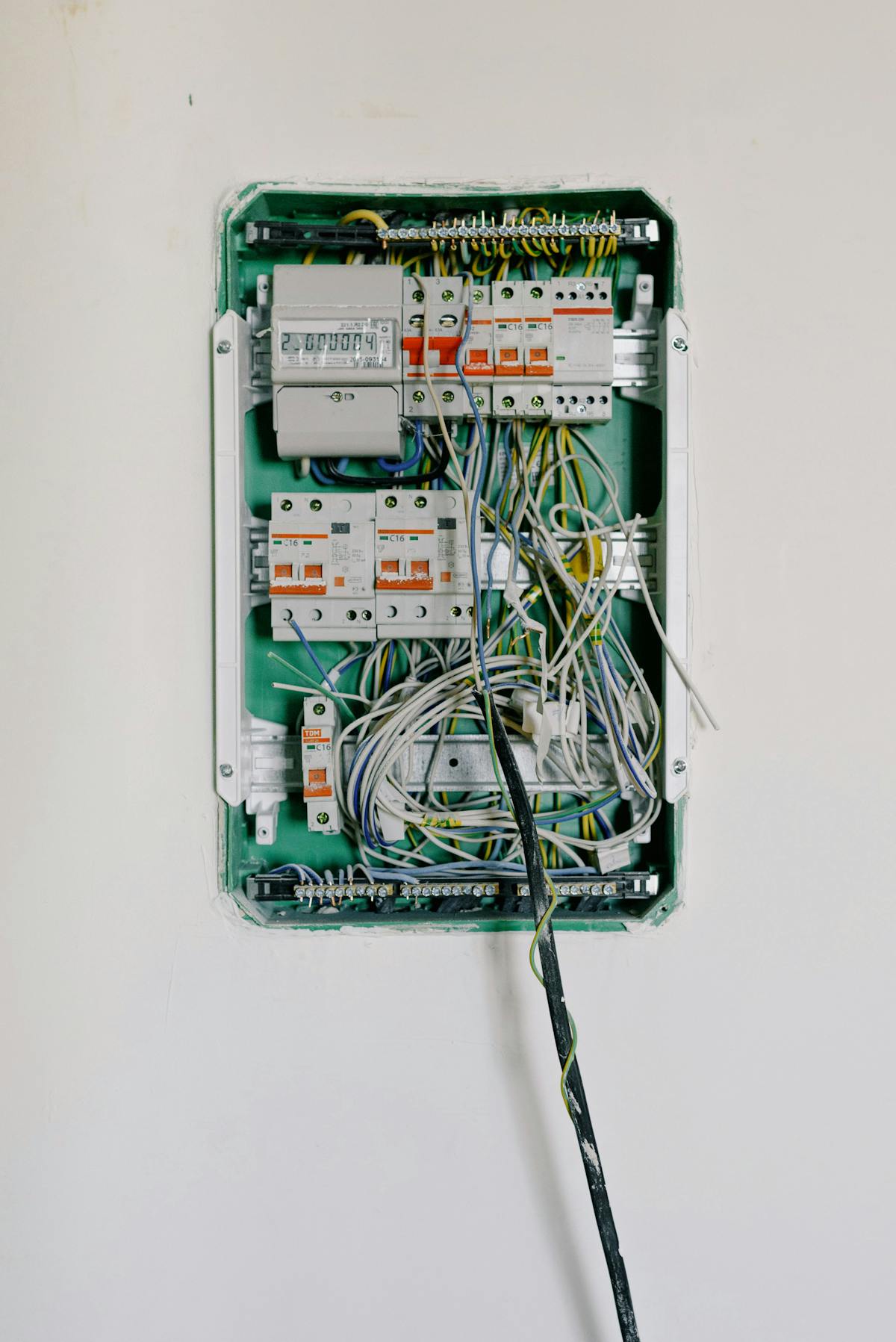 A switchboard with wires connected to electrical switches and circuit breakers.