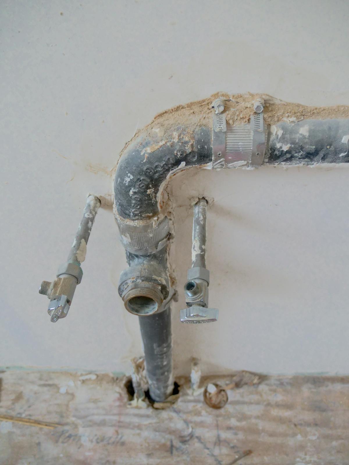 A close-up of plumbing pipes and fittings.